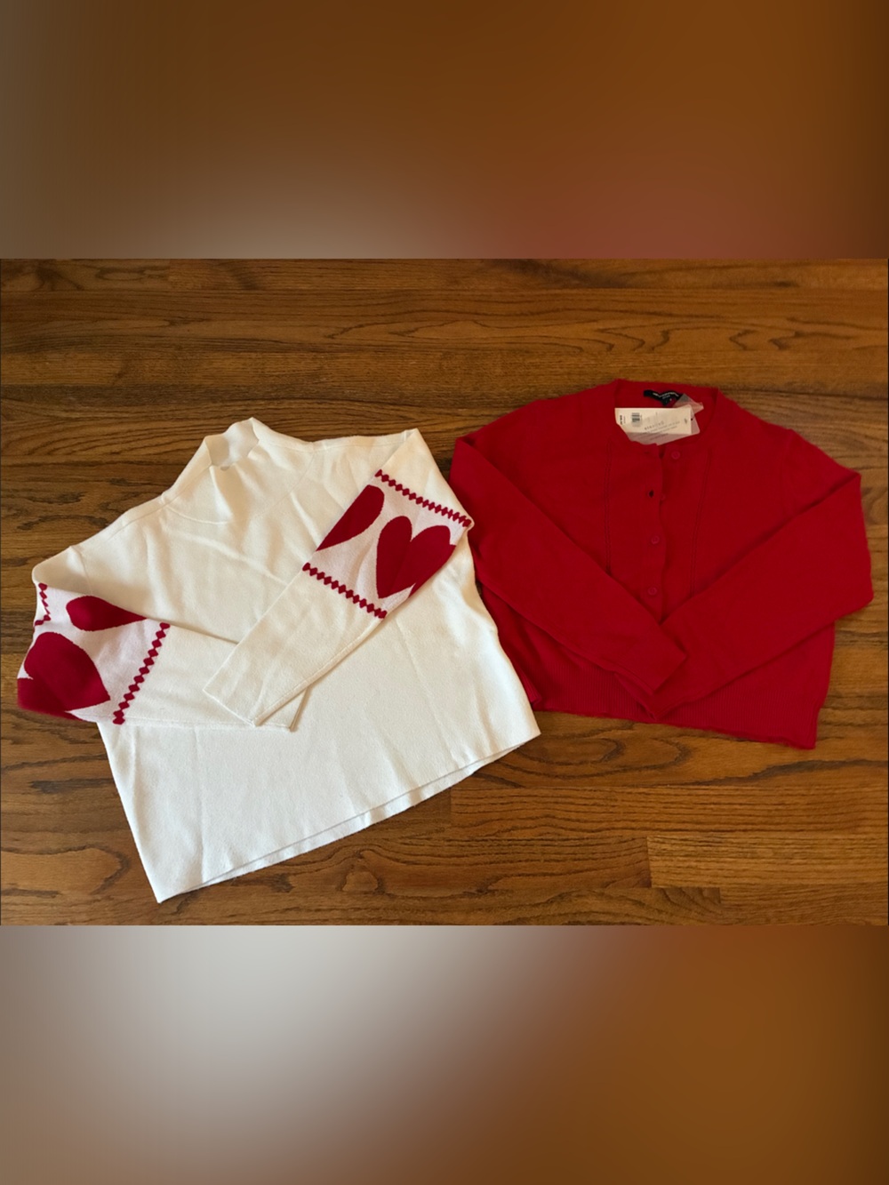 French Connection cardigan and Maeve sweater with red hearts on sleeves.